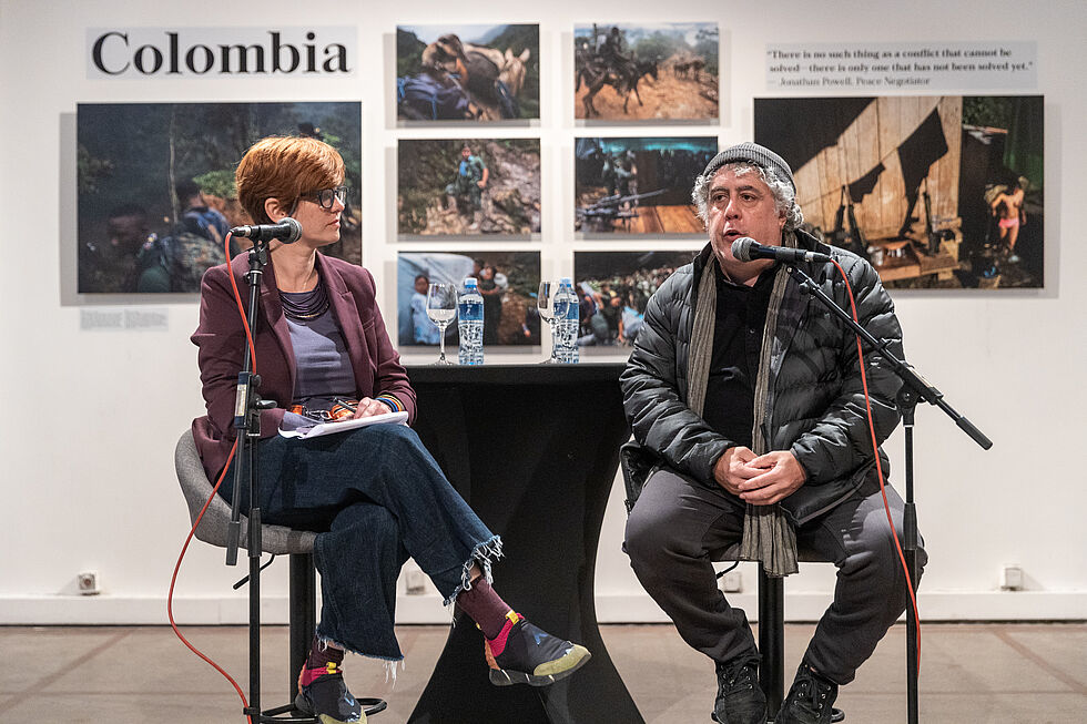 Moderator Mia David with photographer Ron Haviv in live interview.